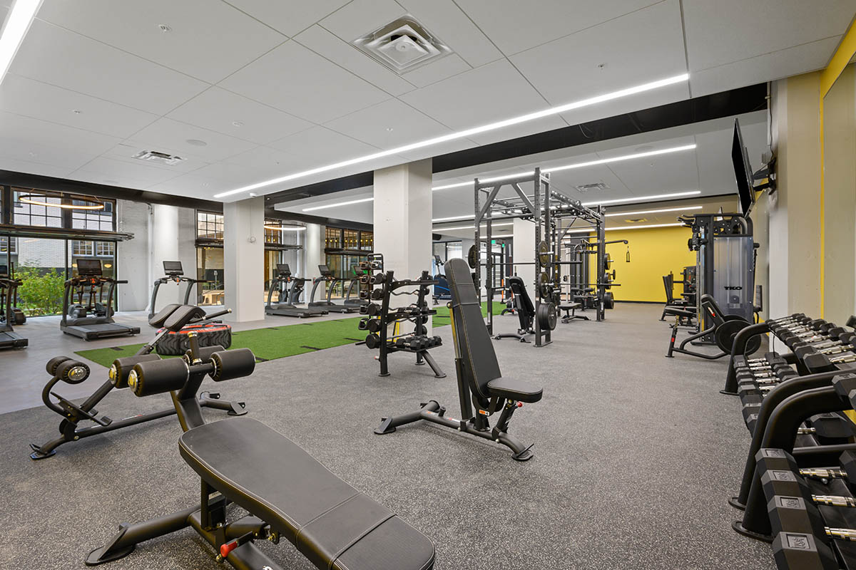Fitness center with cardio machines and weight equipment.